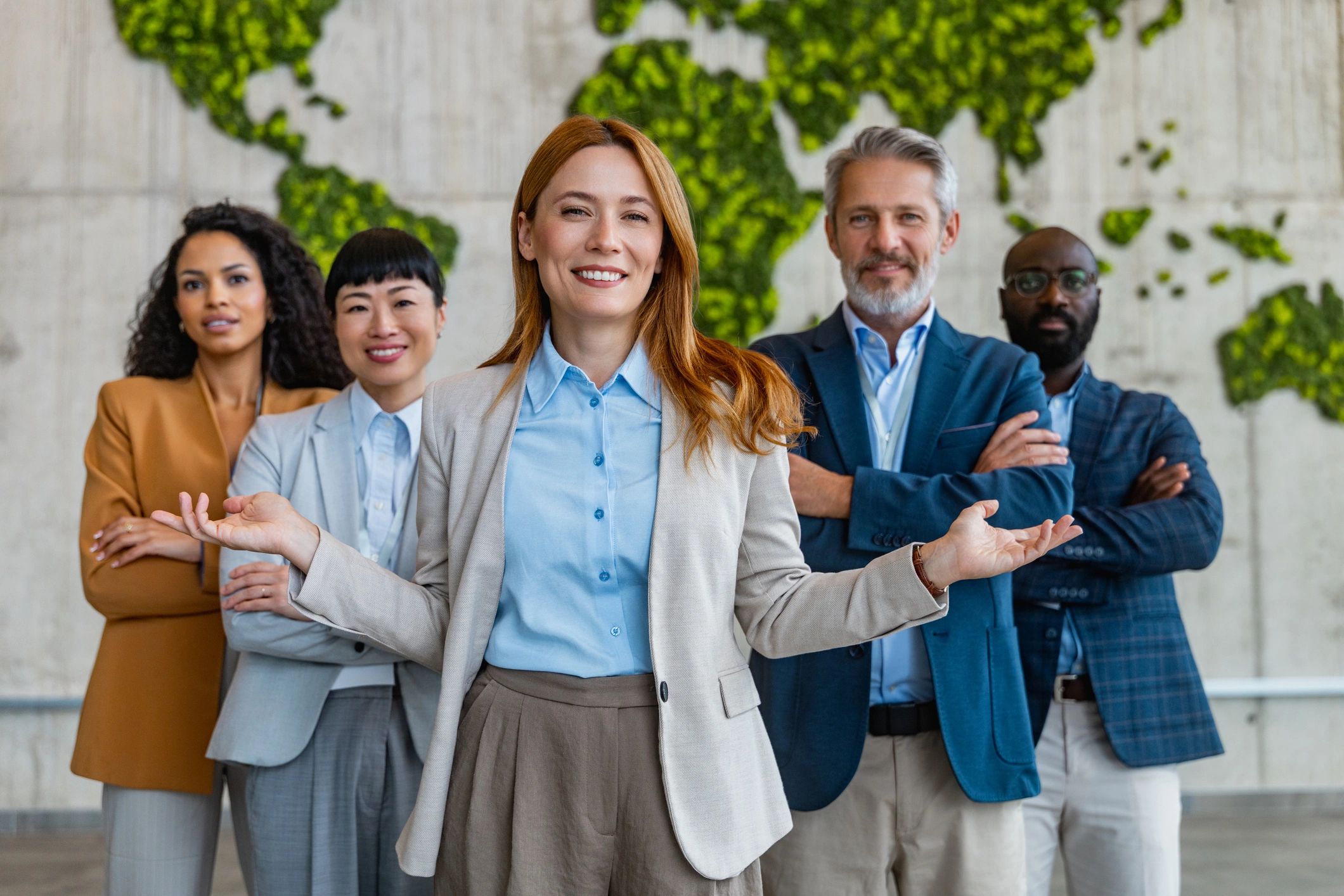 Professional travel agency team standing together in an office